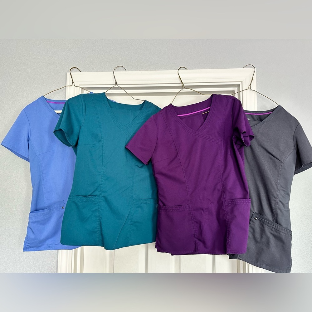Four sets of Healing Hands scrubs